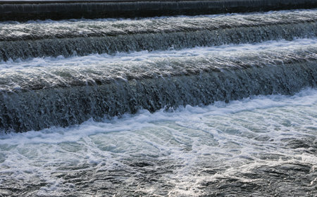 A close-up of a waterfall descending from a lake.の写真素材