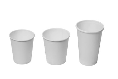 Three white paper disposable cups on a white isolated background.の写真素材