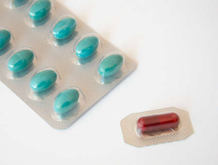 blue tablets and a red oneの写真素材
