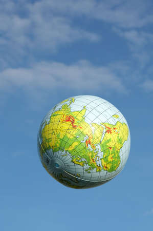 it is the ball of the world floating in the airの写真素材