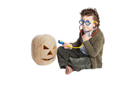 adorable boy as a doctor over a white backgroundの写真素材