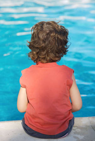 boy who relaxes seeing the water in vacationsの写真素材