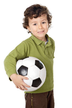 photo of an adorable boy dreaming about being soccer playerの写真素材