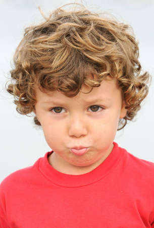 photo of an adorable boy sad and gotten upset