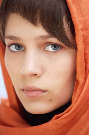 attractive woman with veil in the head a over blue backgroundの写真素材