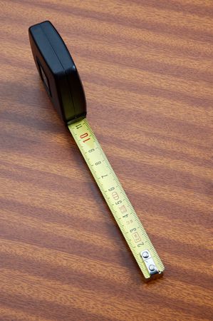 photo of a tape measure on the desk 