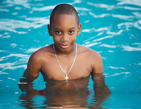 Black boy  in the swimming pool in summerの写真素材