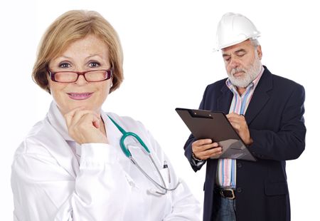 woman doctor and construction supervisor with clipboardの写真素材