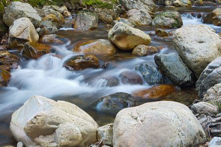 Water movement in the waterfall on stone background