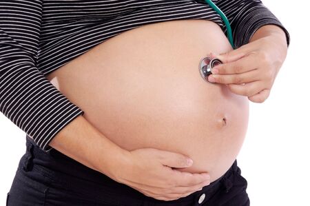 Women pregnant with stethoscope a over white background