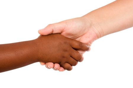 Handshake between races a over white backgroundの写真素材