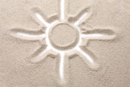 Photo of the sun painted on the sandy の写真素材
