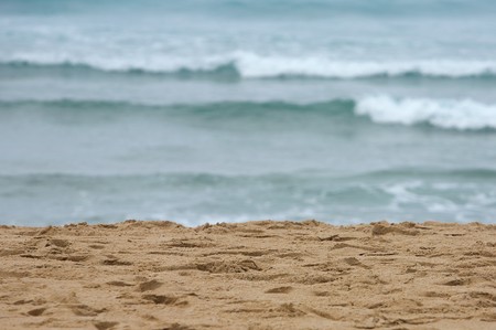 Waves breaking on shore of the sea