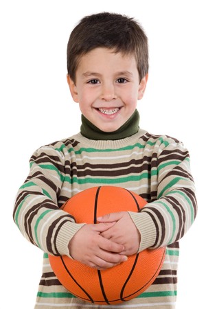 Adorable boy student with basketball isolated over whiteの写真素材