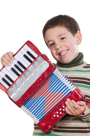 Adorable child playing red accordion on a over white backgroundの写真素材