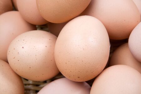 Photo macro of many brown hen eggs
