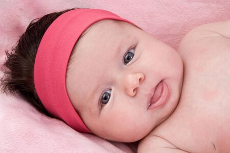 Photo of adorable baby newborn with blue eyes