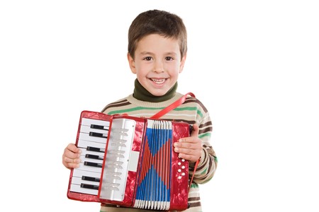 Adorable child playing red accordion on a over white backgroundの写真素材