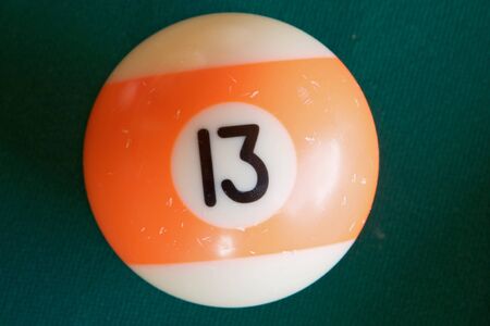 Photo of one billiard ball with number thrirteen