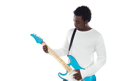 African boy playing electrical guitar a over white backgroundの写真素材