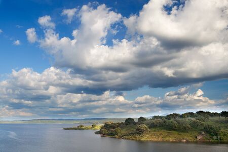 Landscape with a big river and a beautiful skyの写真素材
