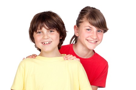 Adorable preteen girl and little boy isolated on white backgroundの写真素材