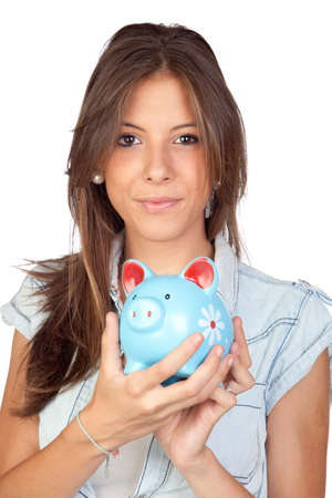 Beautiful girl with a blue piggy-bank isolated on a over white backgroundの写真素材