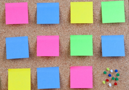 Photo of corkboard with many colour post-itの写真素材