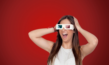 Surprised girl with long hair isolated on red background