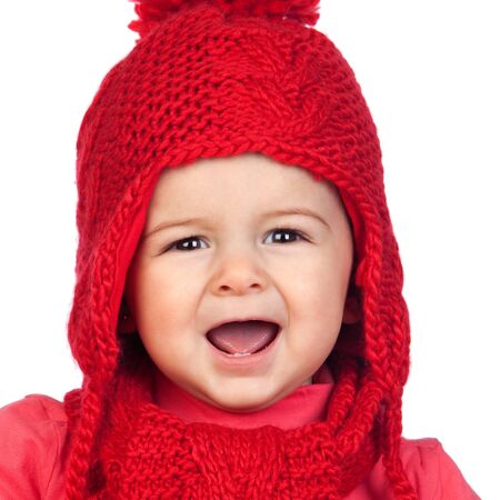 Baby girl with a funny wool red hat isolated on white background