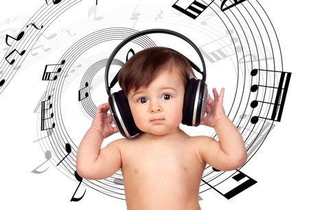 Baby girl listening music and surrounded with a spiral of musical notesの写真素材