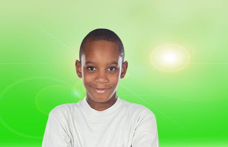 Adorable African boy a over green backgroundの写真素材