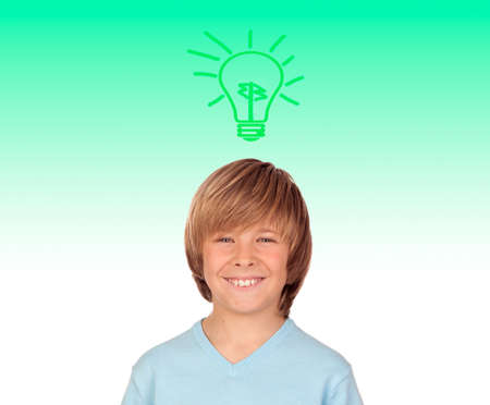 Happy preteen boy with a green bulb over his head の写真素材