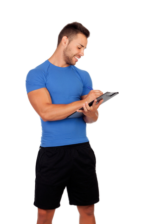 Handsome personal trainer with a clipboard isolated on a white backgroundの写真素材
