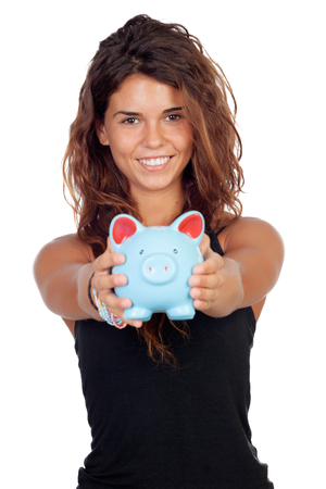 Casual girl with a blue piggy-bank isolated on a white backgroundの写真素材