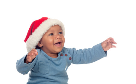 Adorable african baby with Christmas hat isolated on a white backgroundの写真素材