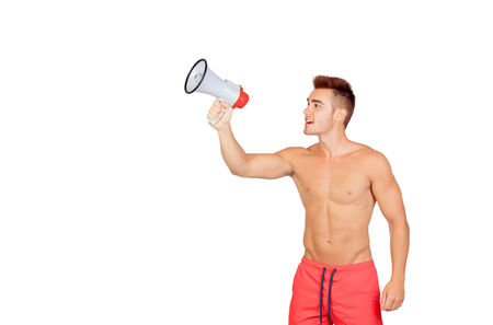 Muscular man with megaphone isolated on a white backgroundの写真素材