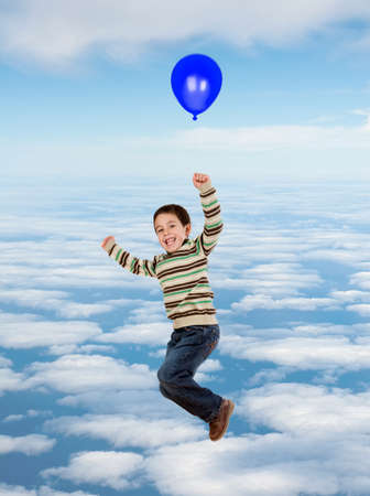 Beautiful child flying on the sky with a balloon isolated on a white backgroundの写真素材