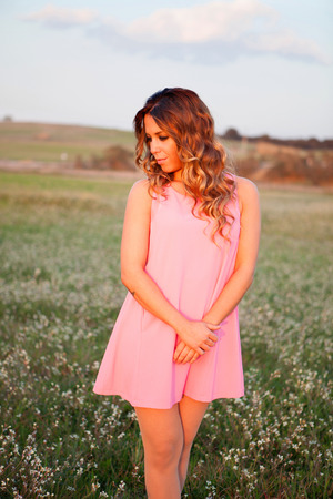 Pretty cool woman dressed in pink with a beautiful smileの写真素材