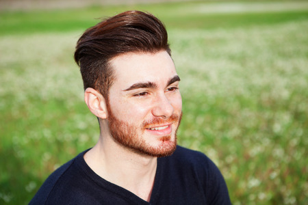 Cool handsome guy with beard smilingの写真素材