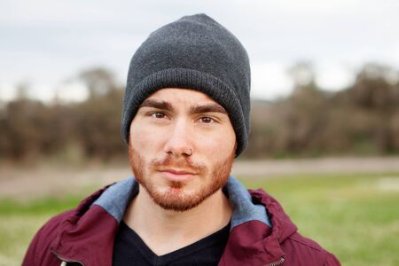 Cool handsome guy with piercing and beardの写真素材