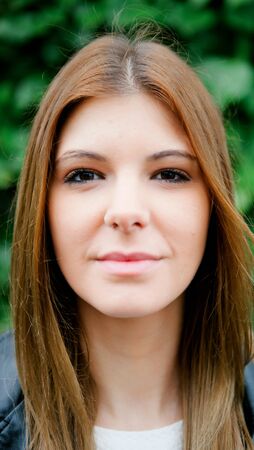 Portrait of a pretty woman relaxed at the parkの写真素材