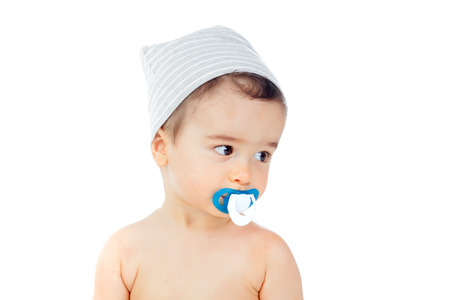 Nice baby with grey cap and pacifier isolated on a white background