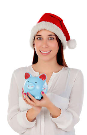 Beautiful woman with Christmas hat and piggy bank isolated on white backgroundの写真素材