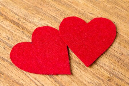 Valentine red hearts on rustic wooden backgroundの写真素材