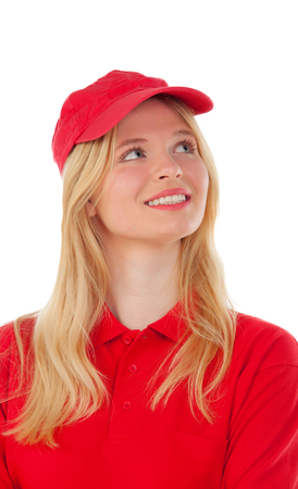 Young blond woman dressed dealer with red uniform isolated on white backgroundの写真素材