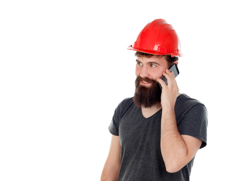 Young men with hipster look and red helmet looking the mobile isolated on white background