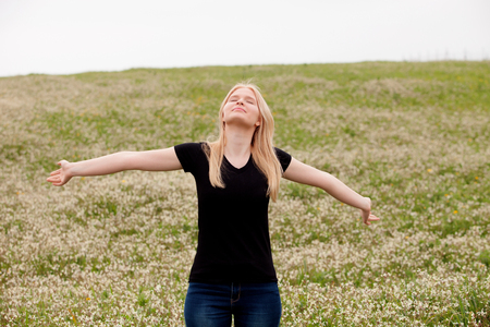 Blonde girl enjoying of good time at springの写真素材