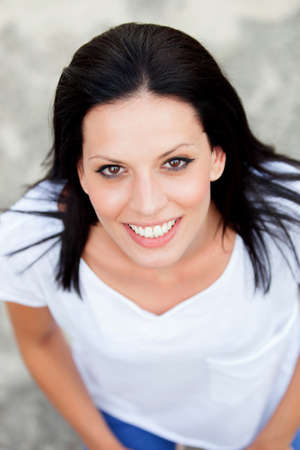 Young brunette woman on the street, seen from aboveの写真素材