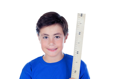 Ten year old boy with a meter of wood isolated on white backgroundの写真素材